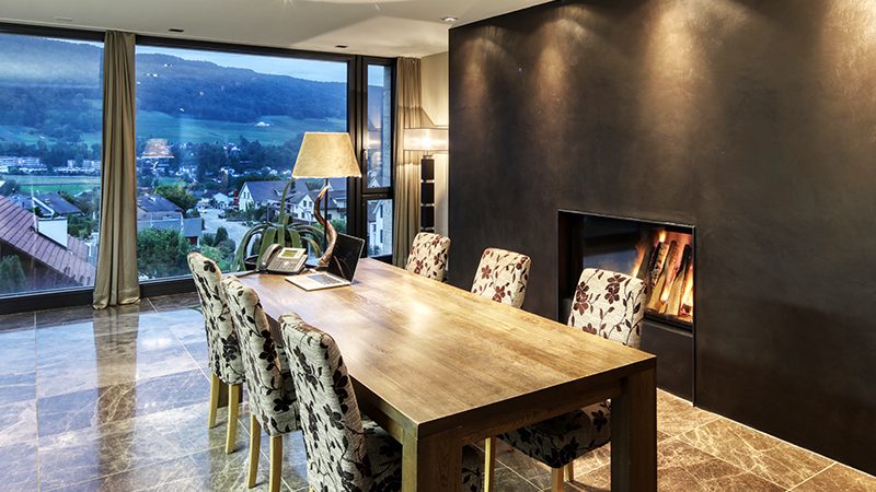 Dining room with a modern fireplace